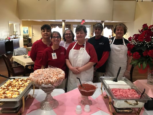 Staff members serving food at McDowell Place