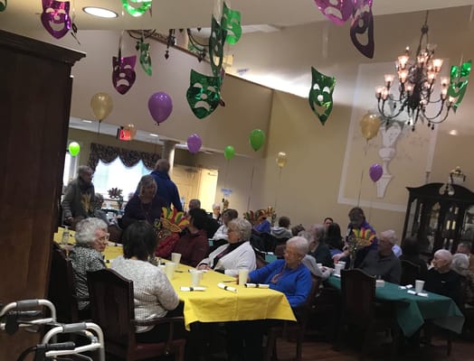 Residents enjoying a festive gathering in a common area
