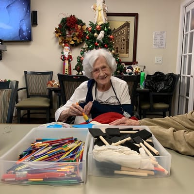Senior resident engaging in an arts and crafts activity