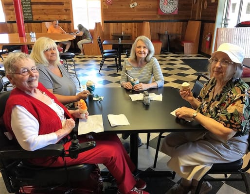 Residents enjoying ice cream in a common area