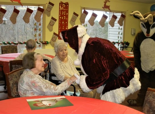 Residents enjoying a holiday celebration with Santa