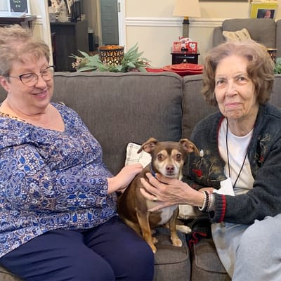Residents enjoying time together with a dog