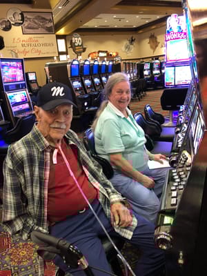 Residents enjoying time at a slot machine area