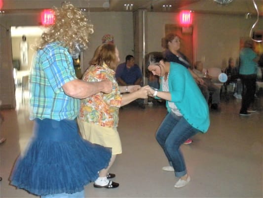 Residents dancing during a community event
