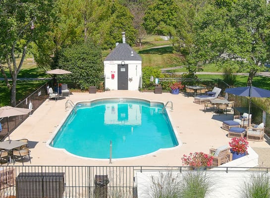 Outdoor swimming pool area with seating