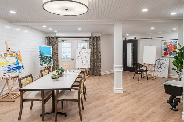 Art room with easels and a dining table