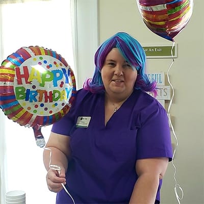 Staff member celebrating a birthday with decorations