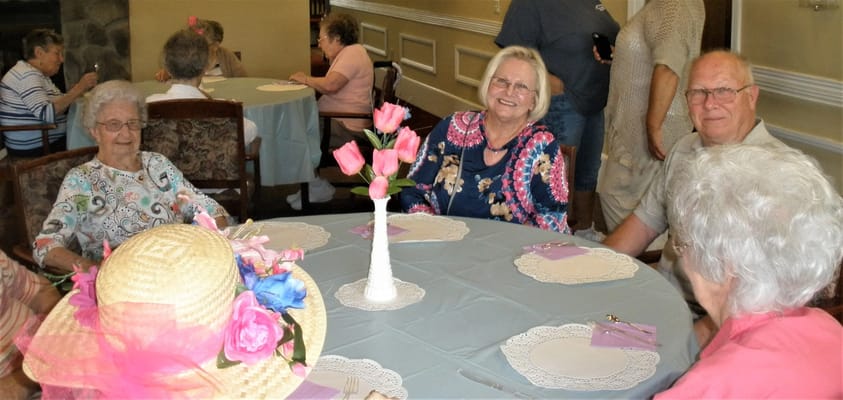 Residents enjoying a social gathering in a common area.