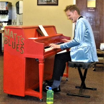 Resident enjoying live music performance in community area