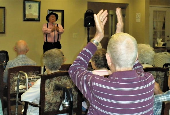 Resident audience enjoying a performance in the common area