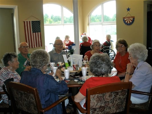 Residents enjoying group conversation in a common area