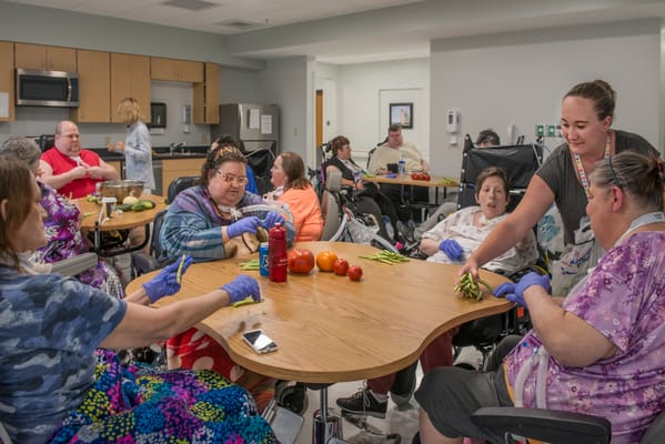 Residents engaged in a group activity in a communal space