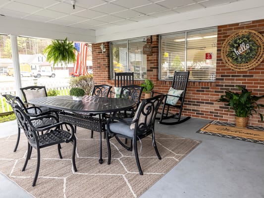 Outdoor seating area with tables and chairs
