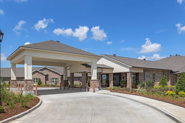 Entrance of Heritage Manor with landscaped surroundings