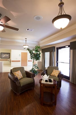 Bright common area with comfortable seating and natural light