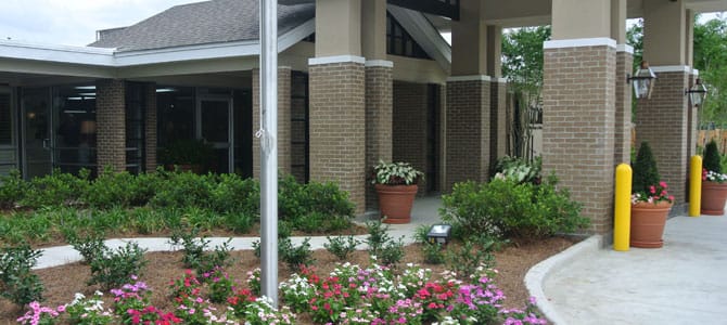 Entrance and landscaped area of Zachary Manor Nursing Center