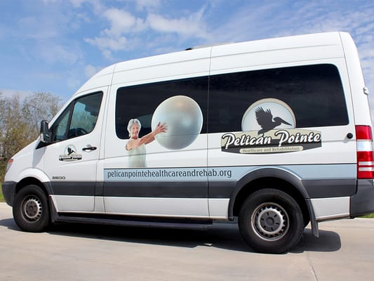 Facility van with logo and contact information