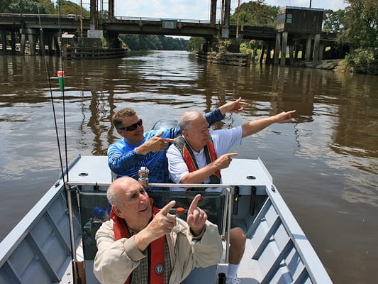 Residents enjoying a boat ride on a river