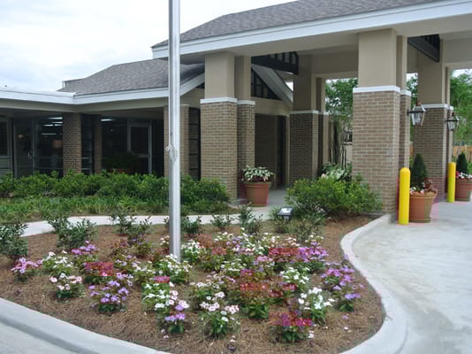 Entrance of a nursing home with blooming flowers