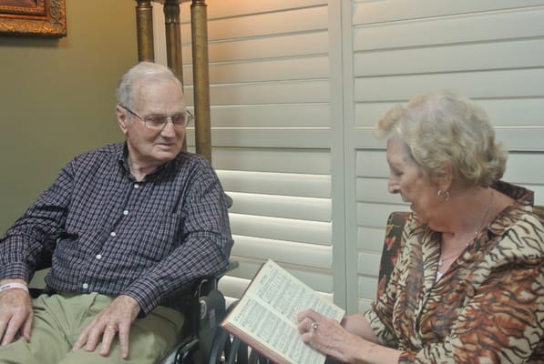 Two residents engaging in conversation in a cozy corner