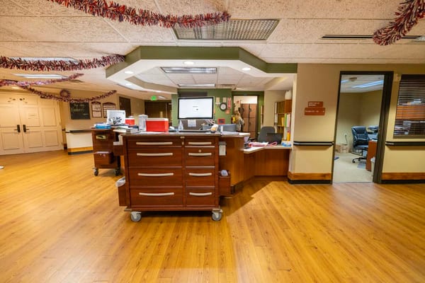 Interior view of a nursing home reception area with festive décor
