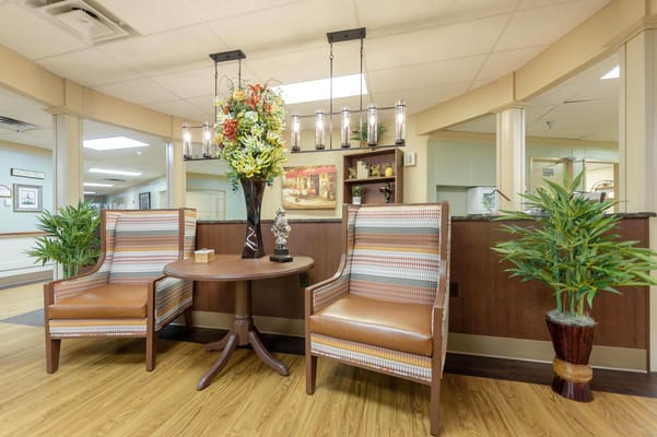 Common area with seating and decorative flowers
