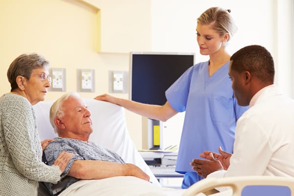 Medical staff attending to elderly residents in a care setting