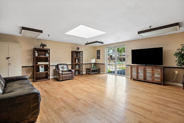 Bright common area with seating and natural light