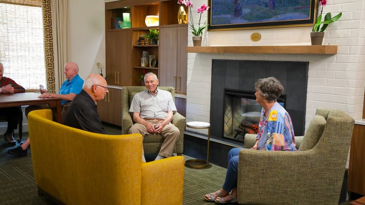 Residents enjoying company in a cozy common area