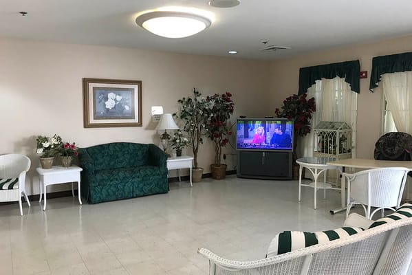 Common area with seating and television