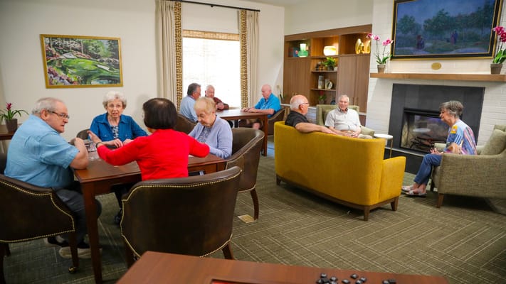 Residents engaging in a group activity in the common area
