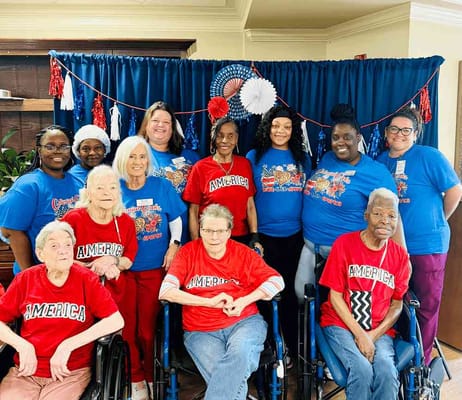 Residents and staff celebrating in patriotic shirts