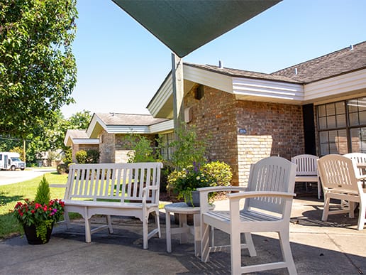 Outdoor seating area with benches and plants
