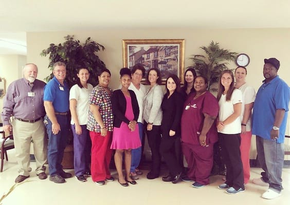 Staff members posing in a common area