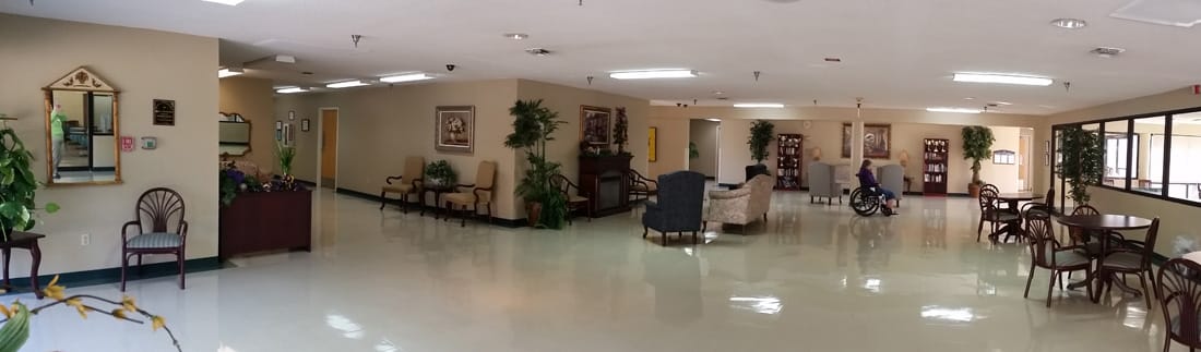 Interior common area with seating and residents