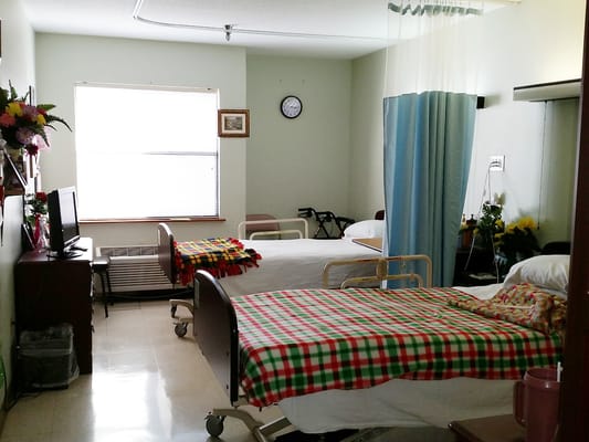 Interior view of a shared resident room with beds