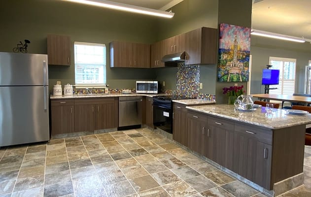 Modern kitchen area with granite countertops