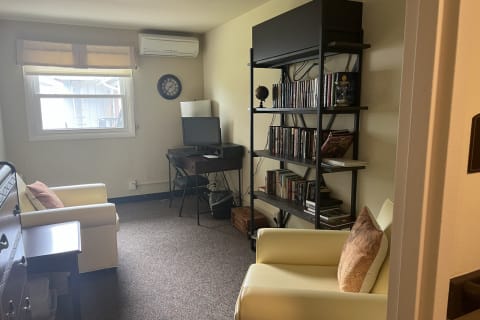 Cozy living area with two chairs and a TV