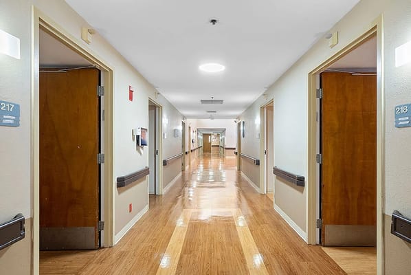 Bright hallway with resident room doors