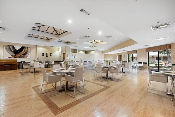 Bright dining room with modern decor and tables