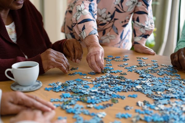 Residents working together on a puzzle activity
