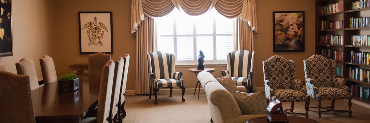 Bright common area with seating and bookshelves