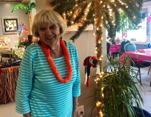 Resident enjoying a festive celebration with decorations