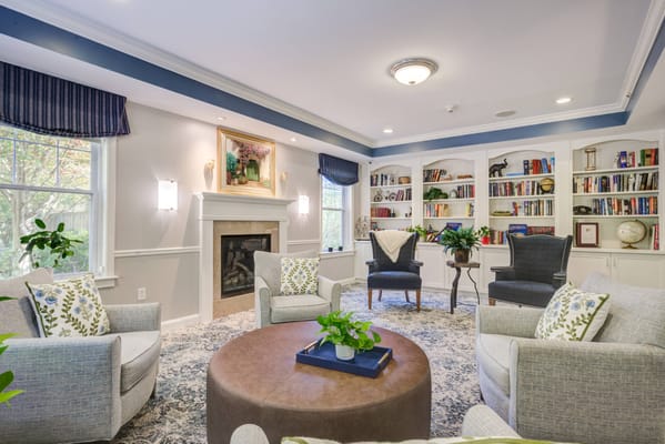 Interior common area with seating and bookshelves