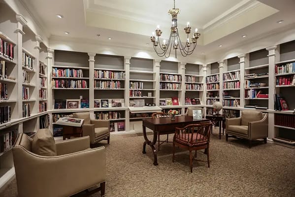 Cozy library with shelves of books and seating