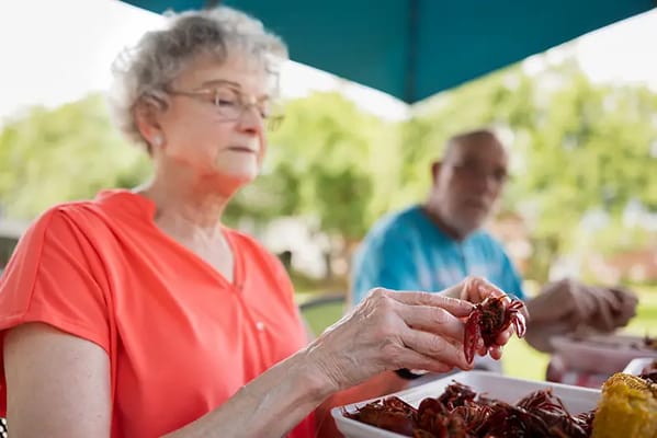 Residents enjoying a crawfish boil outdoors
