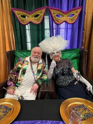 Residents celebrating at a festive event with masks