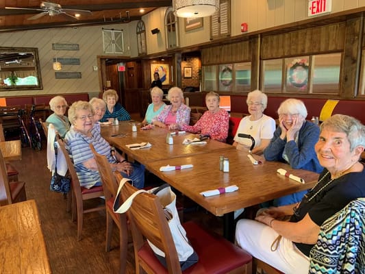 Residents enjoying a meal together in a dining room