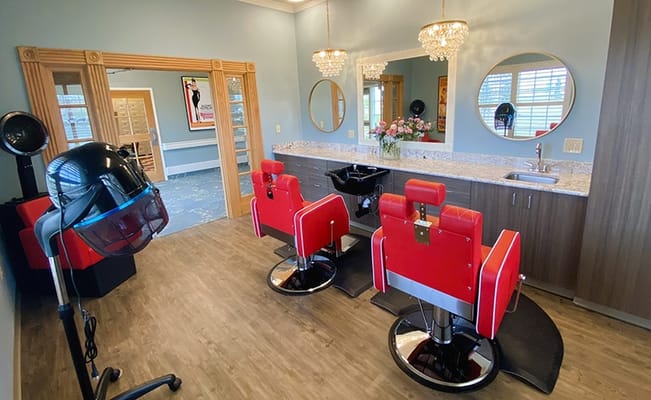 Interior view of a salon area with styling chairs