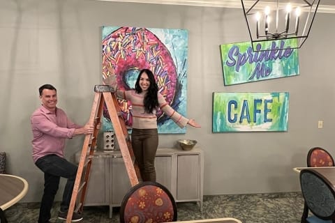 Staff engaging in decorating a cafe area